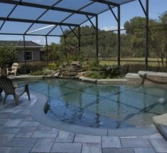 Concrete Pool and Spa with Firepit and Rock Waterfall