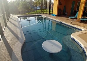 Custom Concrete Pool with cocktail table Palm Coast